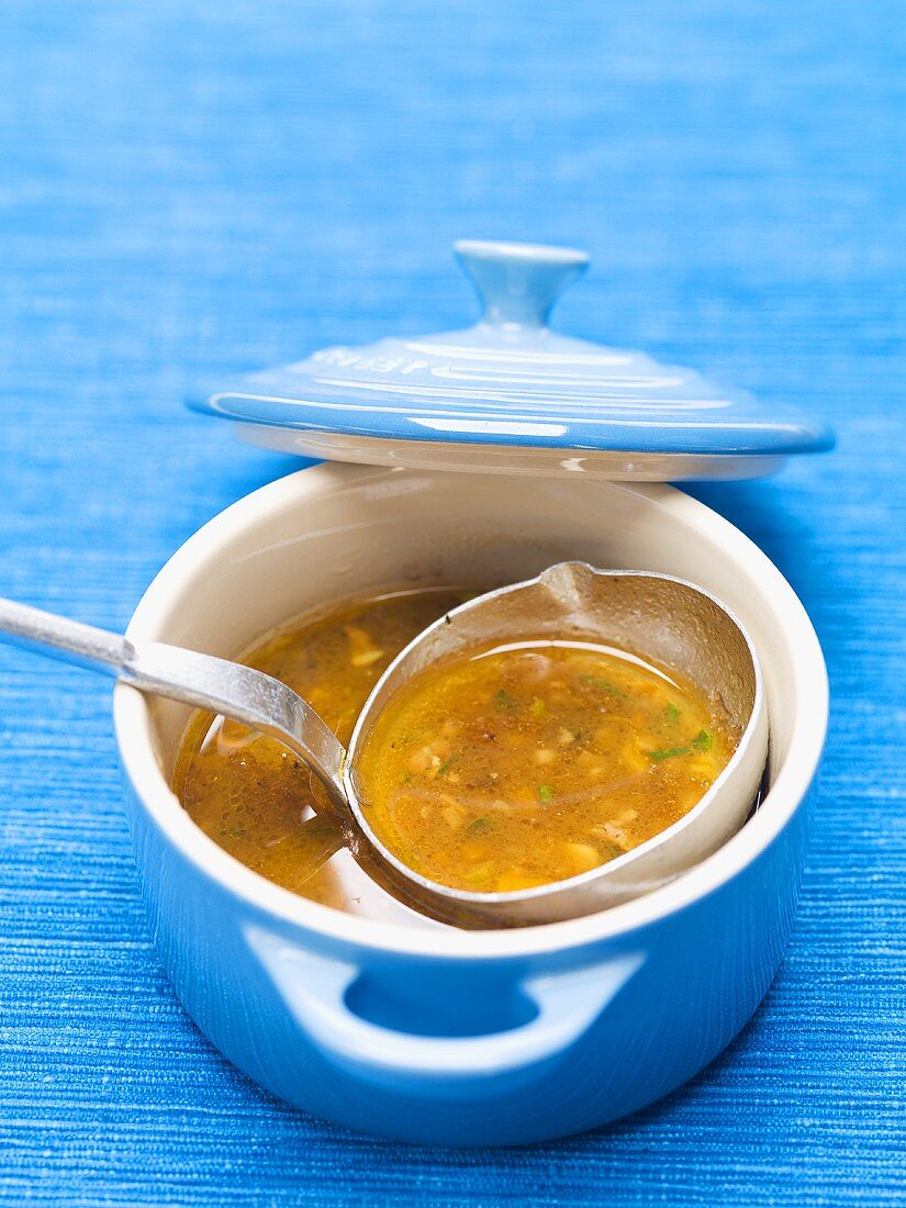 Meat soup in a blue pot