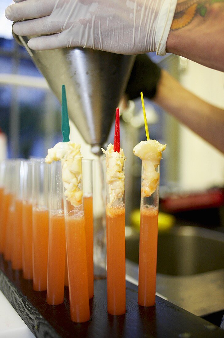 Tomato consommé with scampi in test tubes