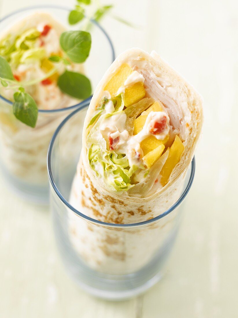 Turkey and vegetable wraps in two glasses