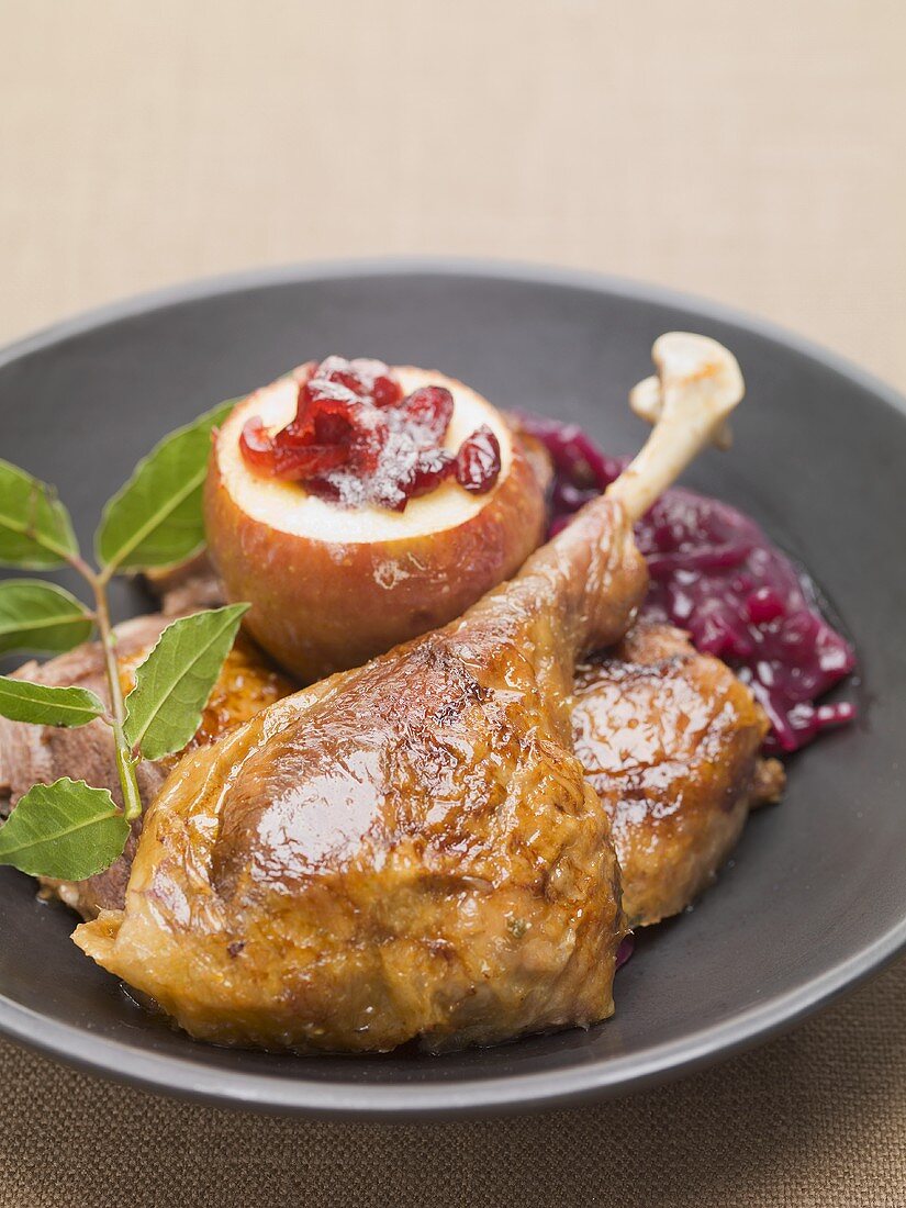 Roast duck with red cabbage and pear with cranberries