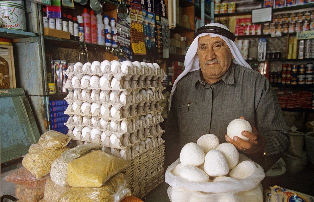 Vendor selling jameed (dry, salted goat's milk yoghurt, Jordan)