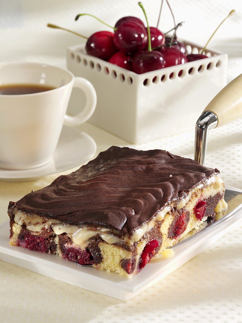 Danube Waves Cake on cake slice, cup of coffee