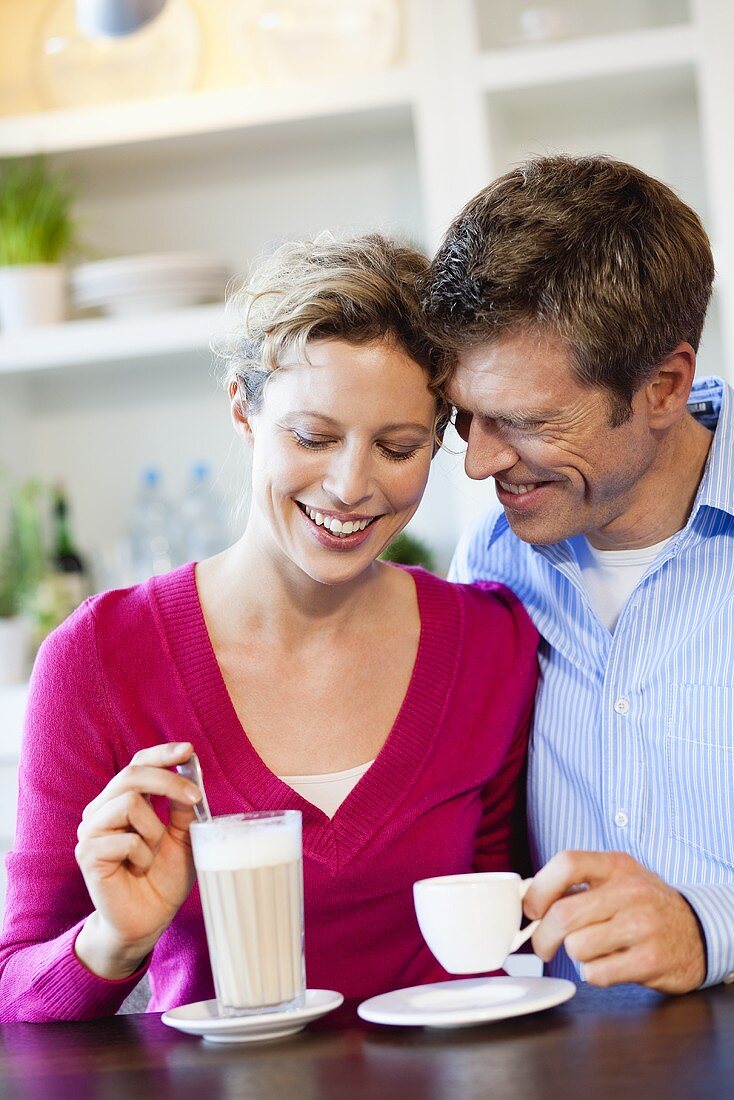 Courting couple drinking coffee