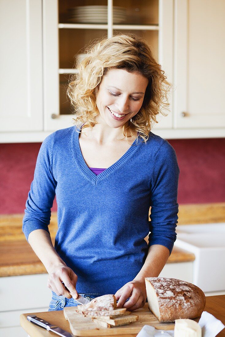 Woman slicing bread