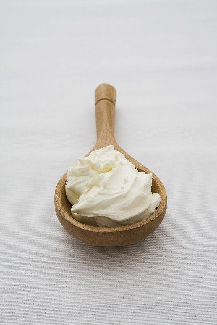 Soft (fresh) cheese on a wooden spoon