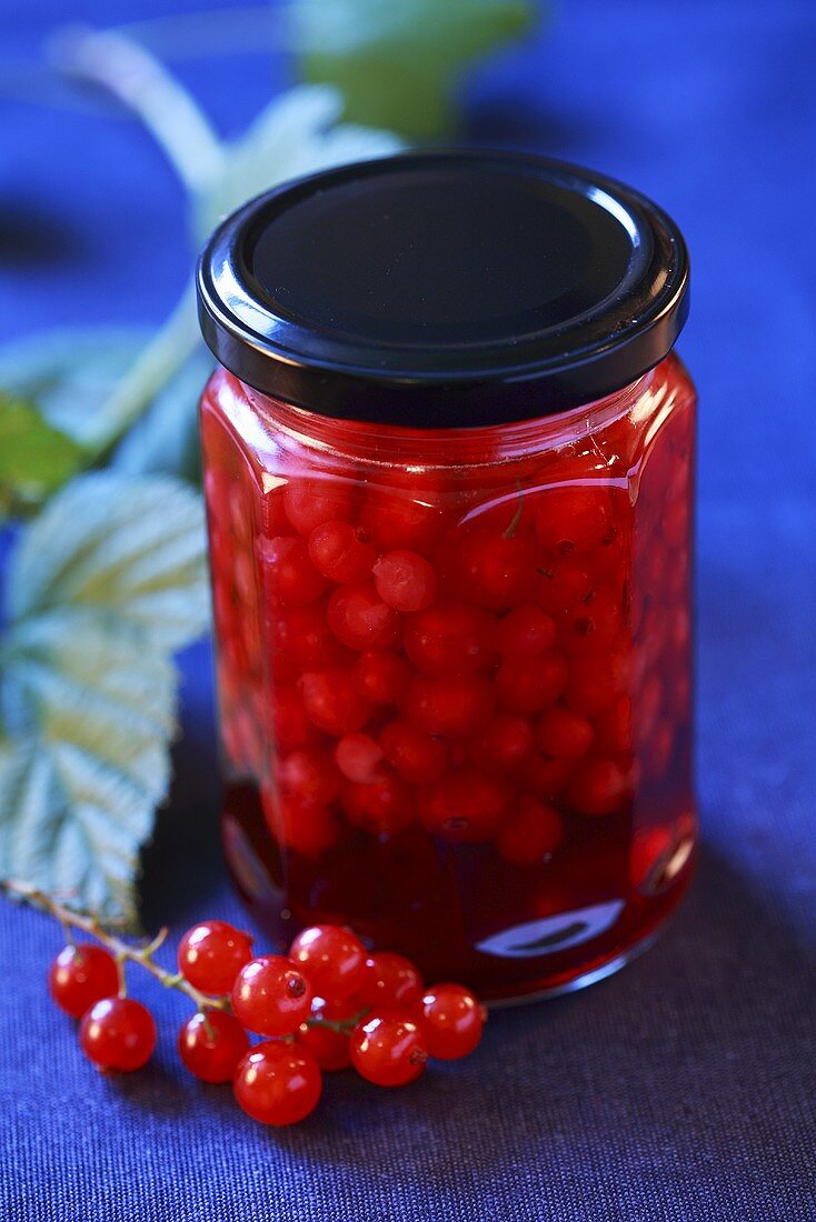 Redcurrent compote in a jar