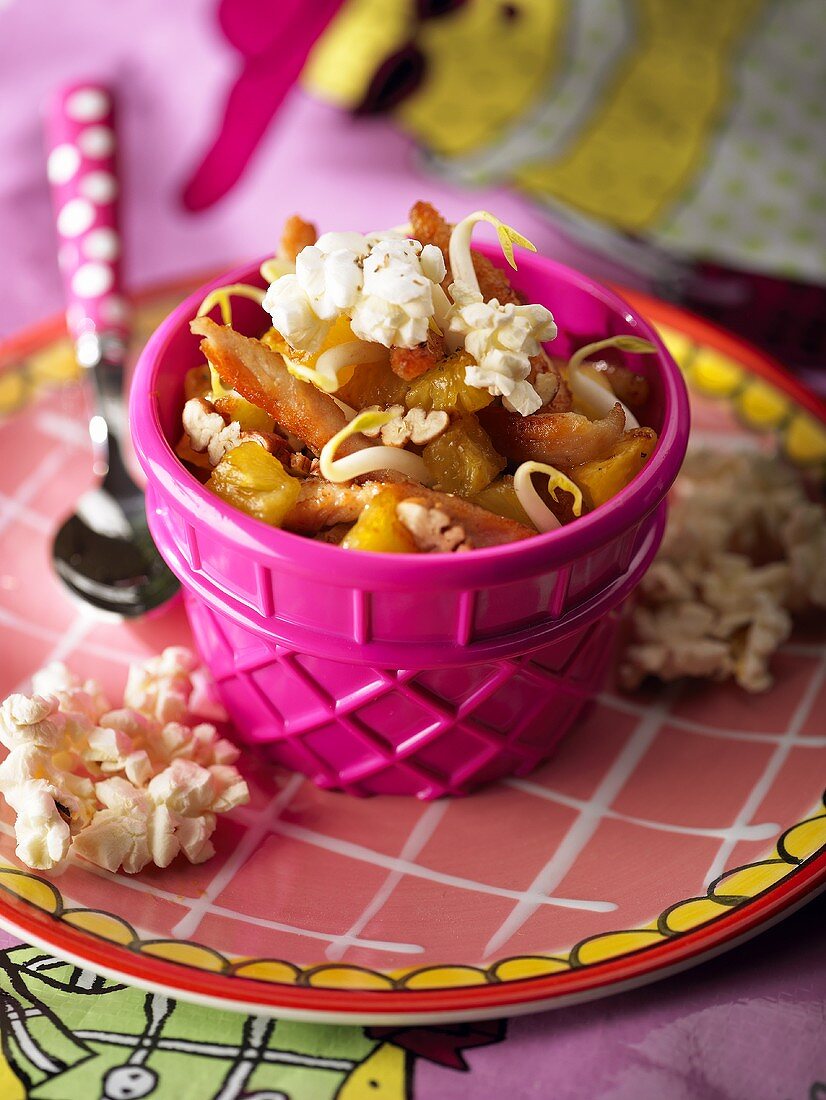 Fried chicken breast with pineapple and popcorn
