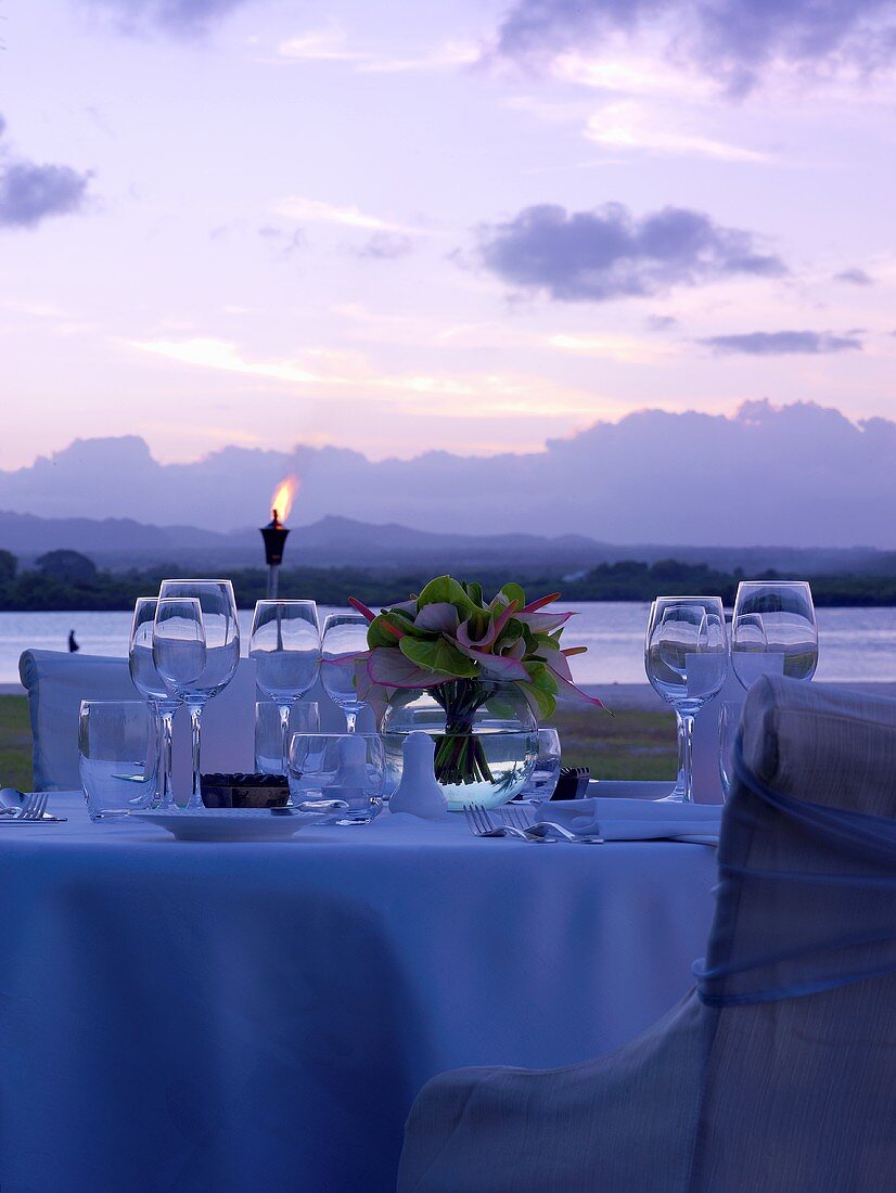 Laid table on Mauritius at twilight
