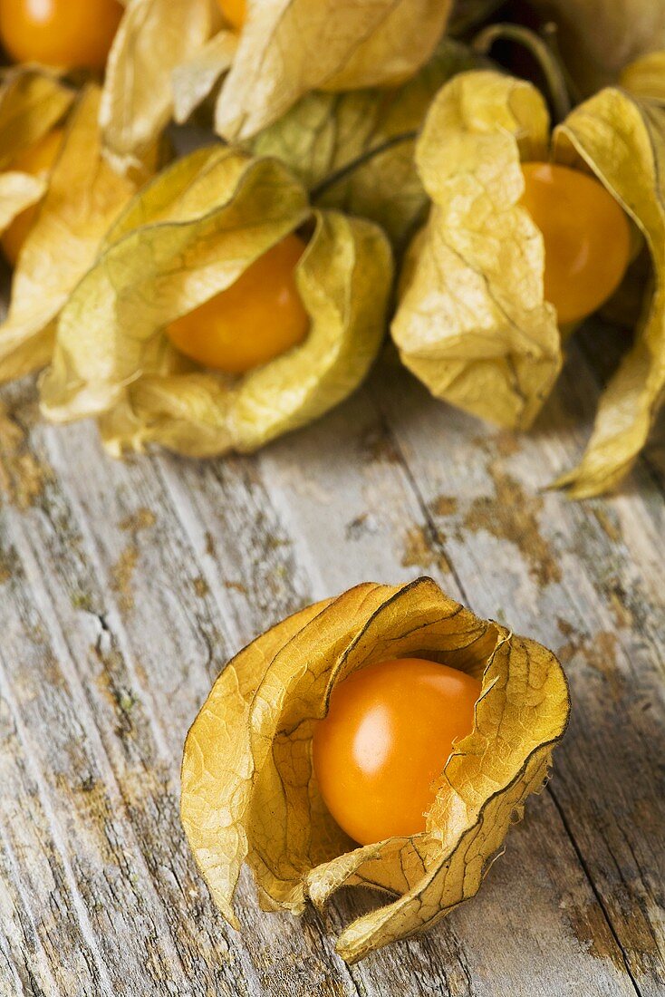 Cape gooseberries on wooden background