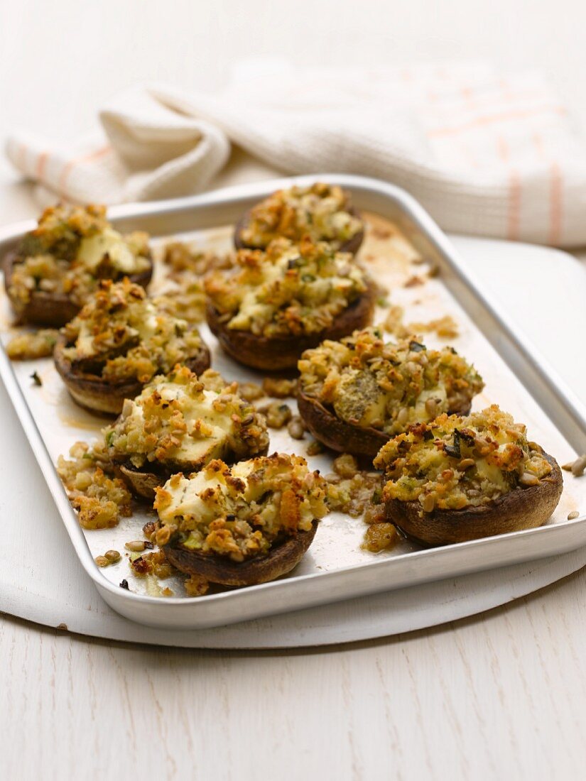 Baked mushrooms with cheese and pine nut stuffing