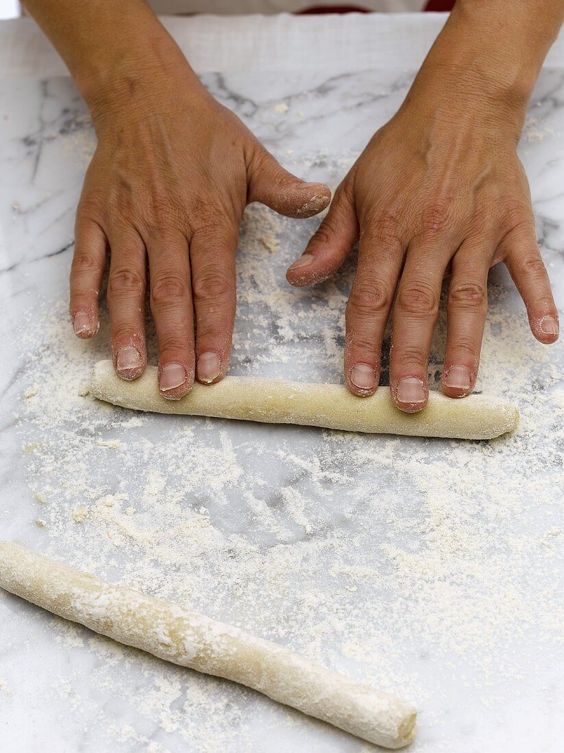 Making gnocchi: rolling the dough into a 'sausage'