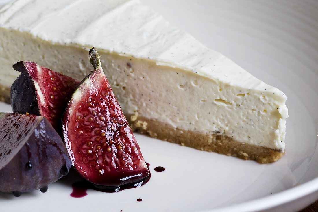 A piece of vanilla cheesecake with figs