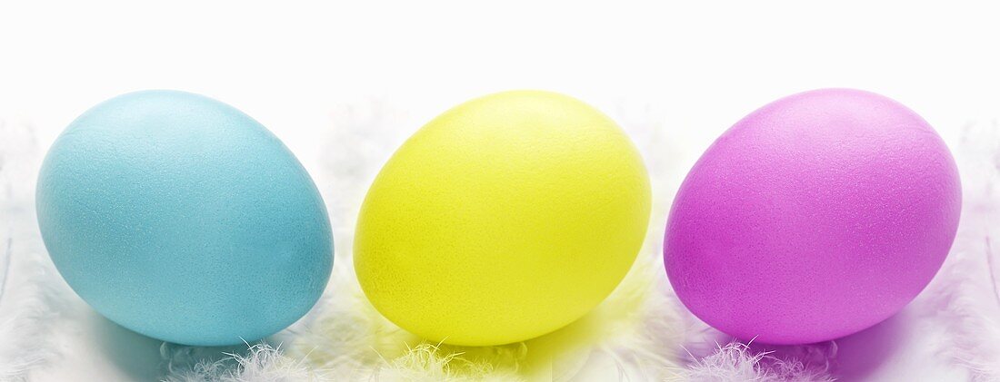 Three Easter eggs (blue, yellow, purple)