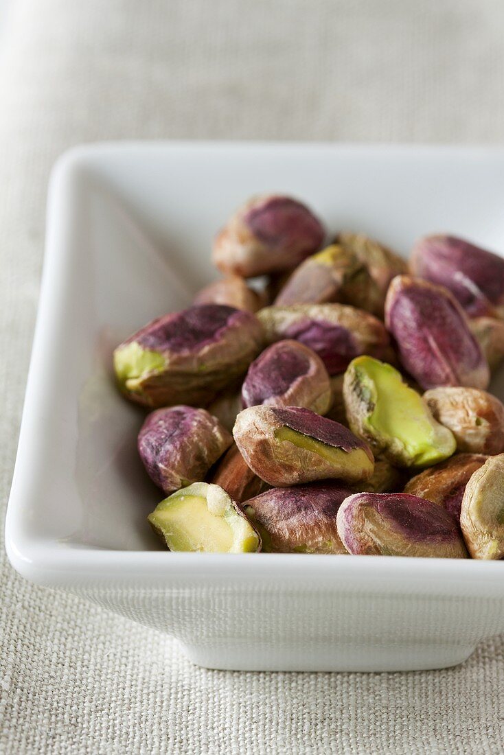 Shelled pistachios in a dish