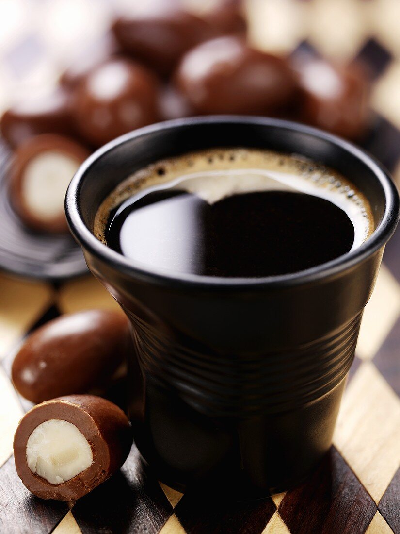Cup of coffee with chocolate Brazil nuts
