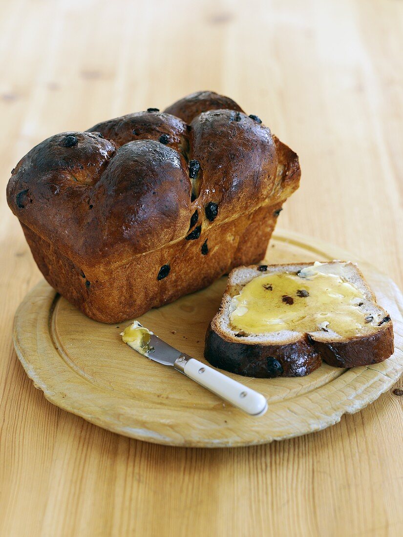 Cinnamon raisin bread, one slice buttered with honey