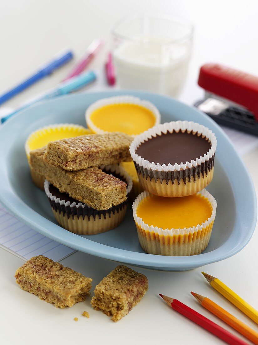 Sweet cup cakes and muesli bars for children