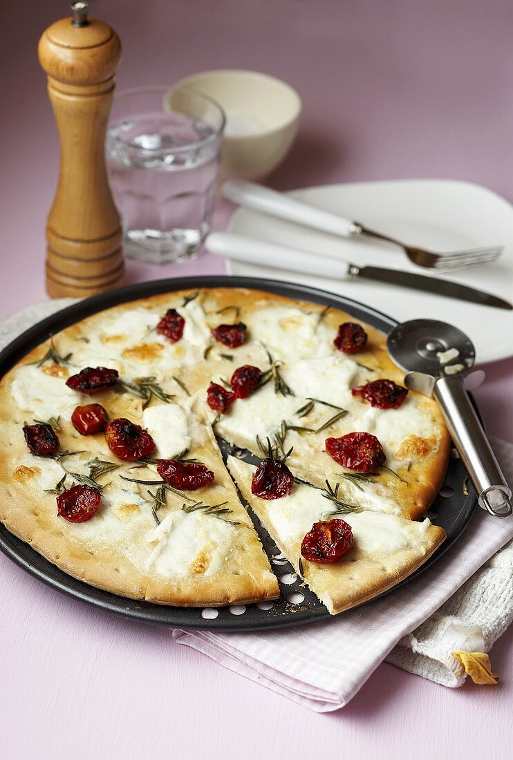 Pizza with ricotta, cherry tomatoes and rosemary
