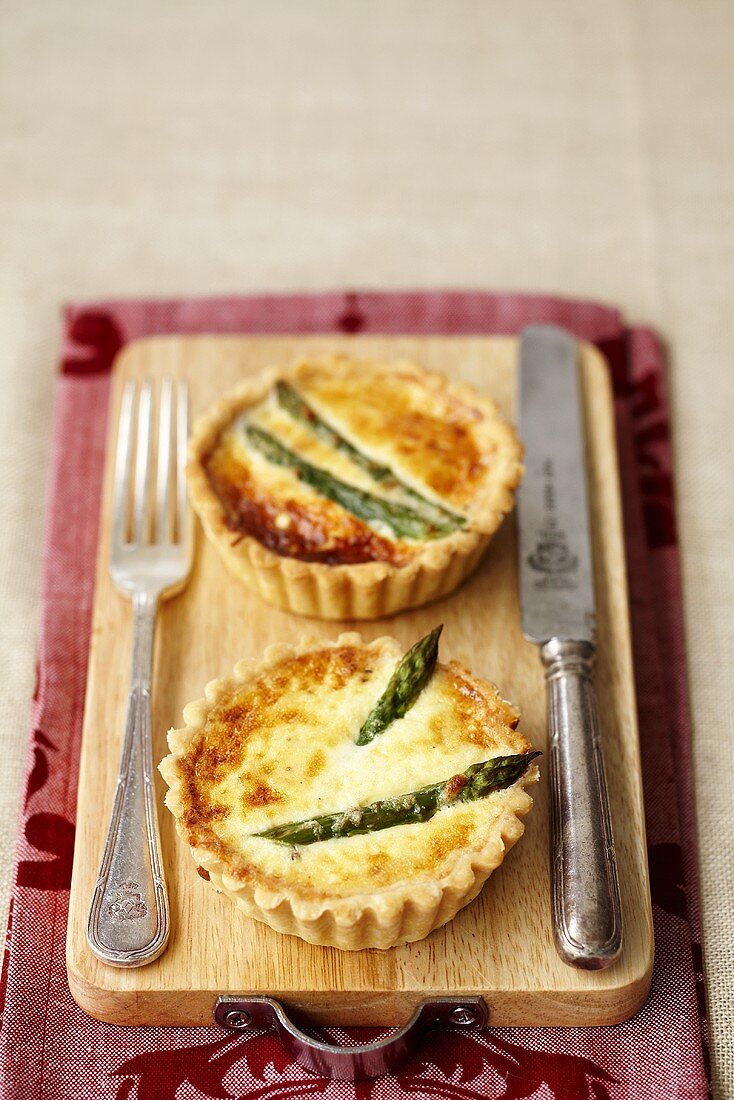 Two asparagus and parmesan tarts