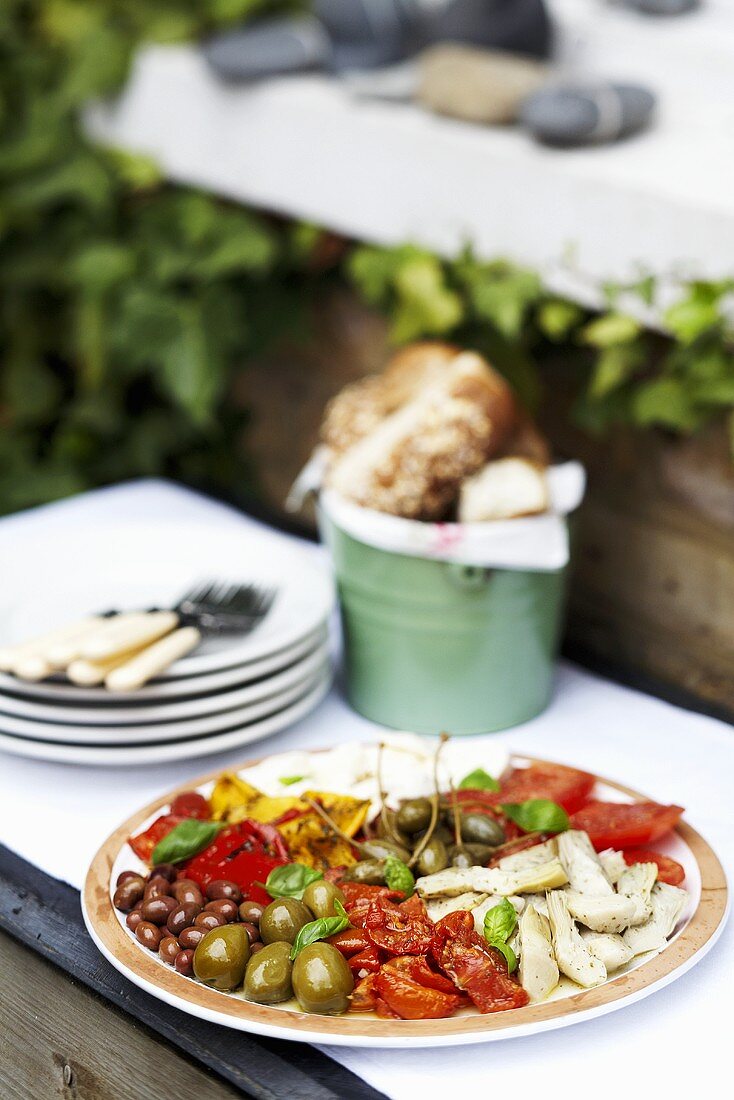 A plate of antipasti outdoors