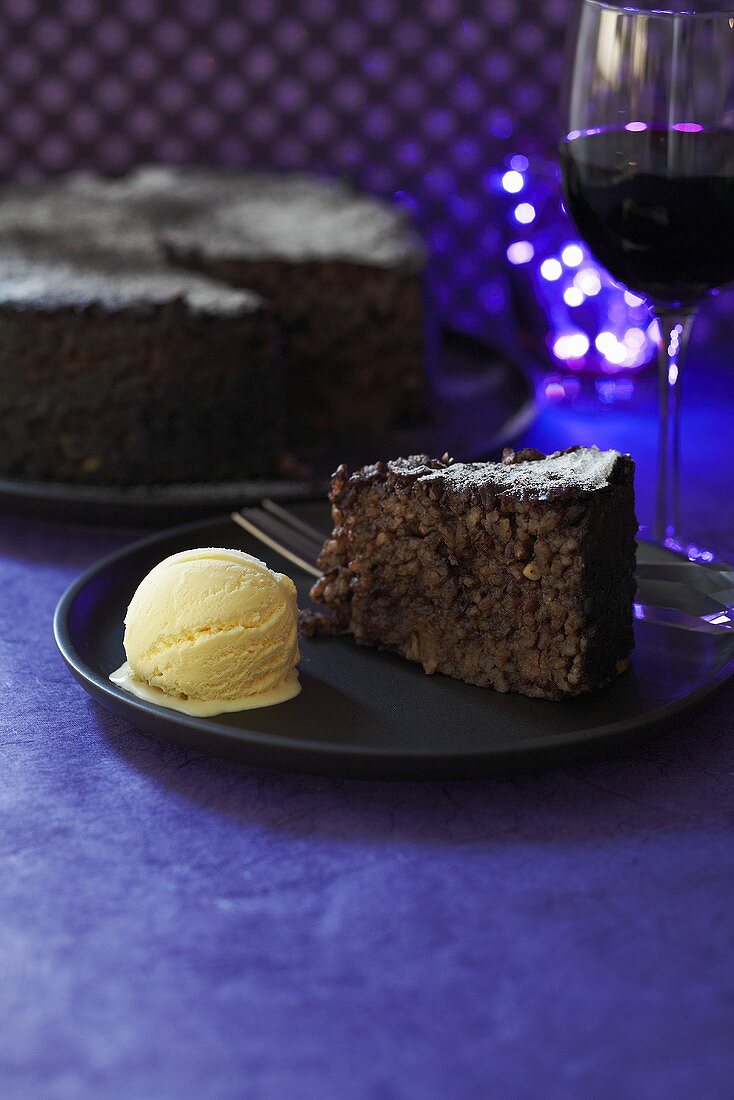 Chocolate cake with vanilla ice cream and dessert wine