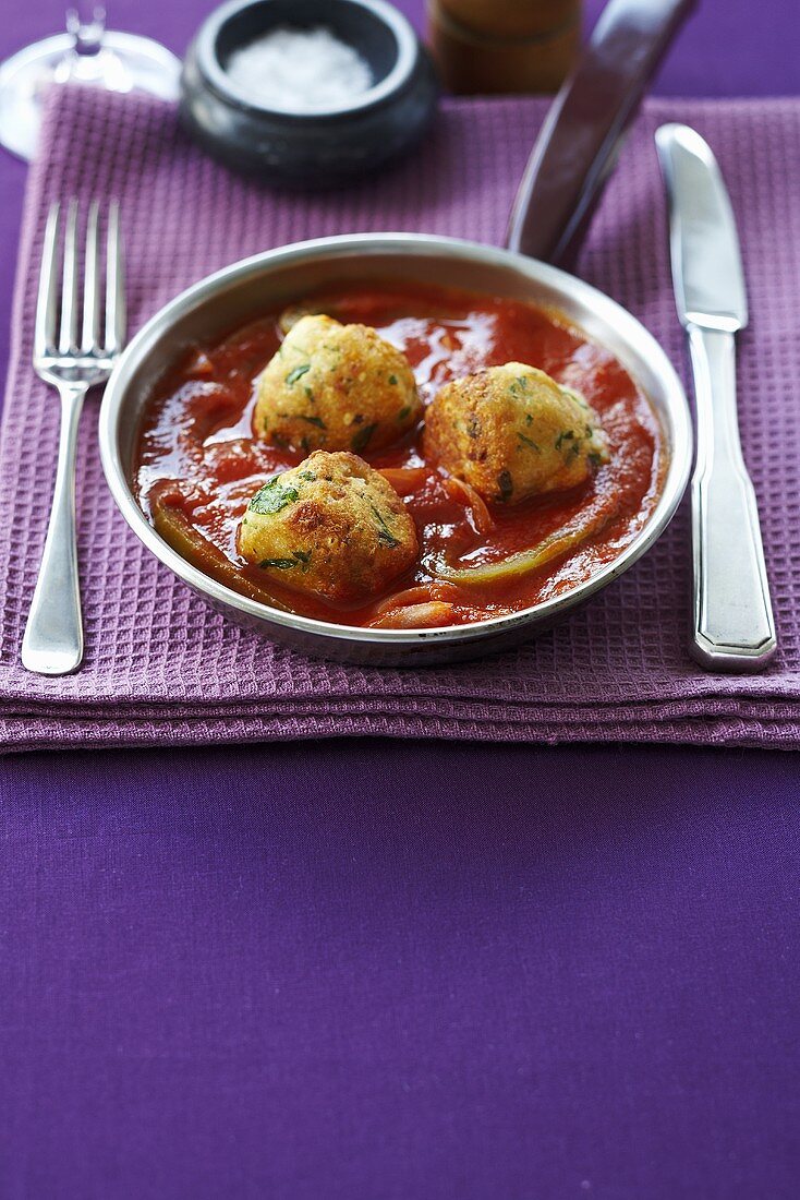 Cheese balls in tomato sauce