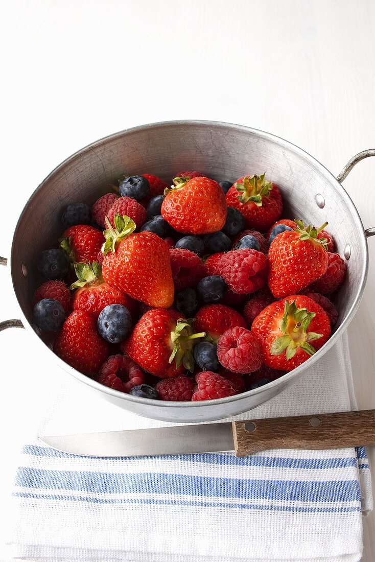 Fresh berries in colander