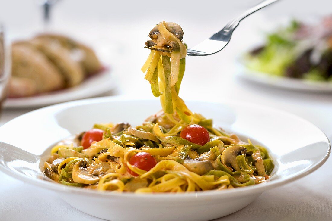 Tagliatelle with mushrooms and cherry tomatoes