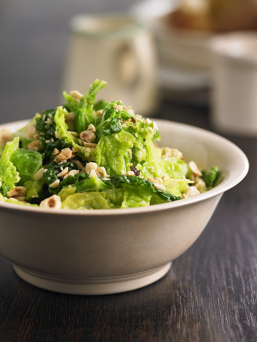 A bowl of savoy cabbage with nuts