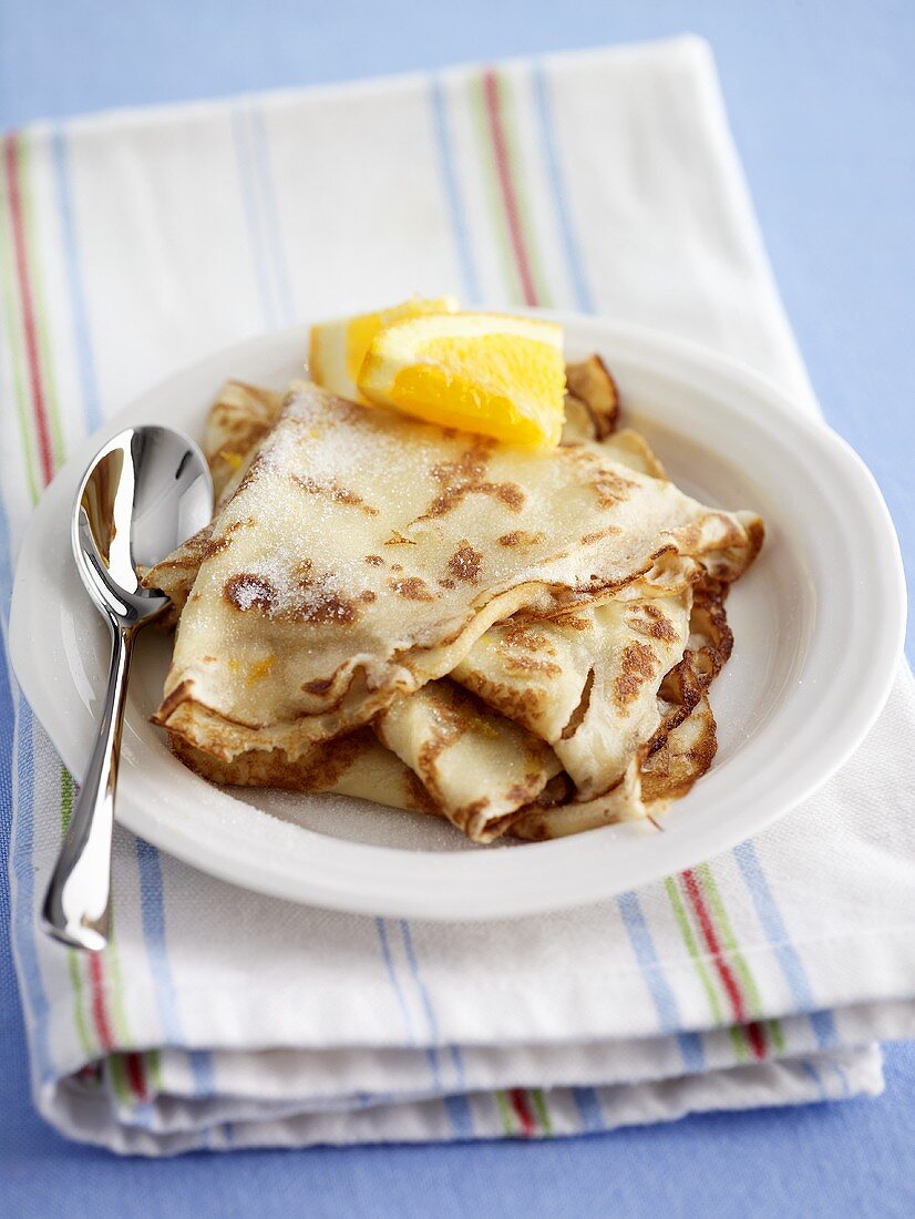 Pancakes with sugar and orange