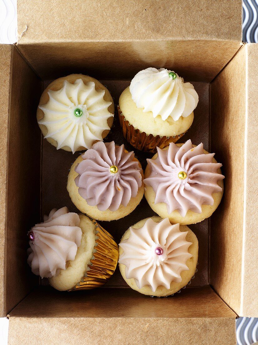 Several cupcakes in a box (overhead view)