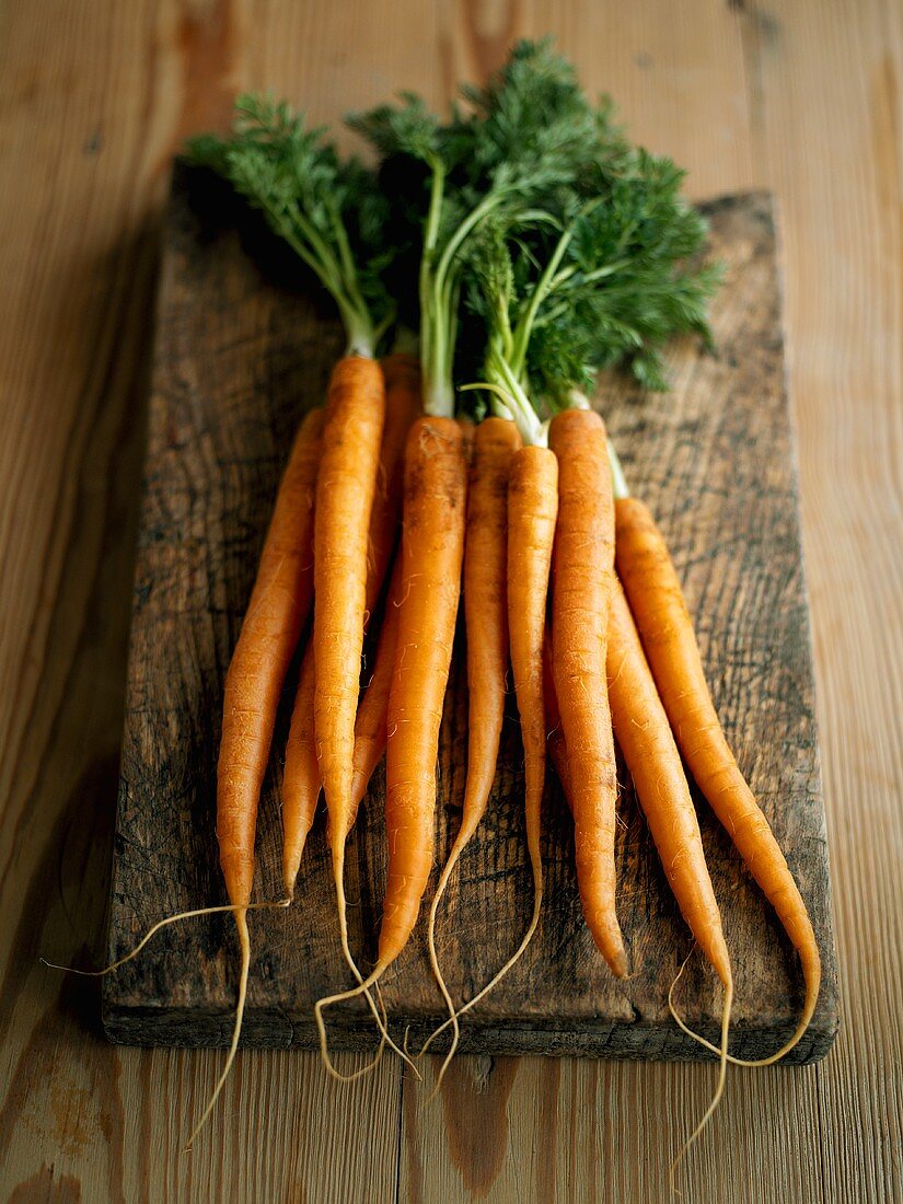 Fresh carrots on chopping board