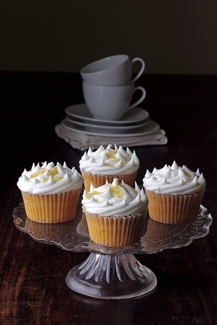 Lemon meringue cupcakes on a cake stand