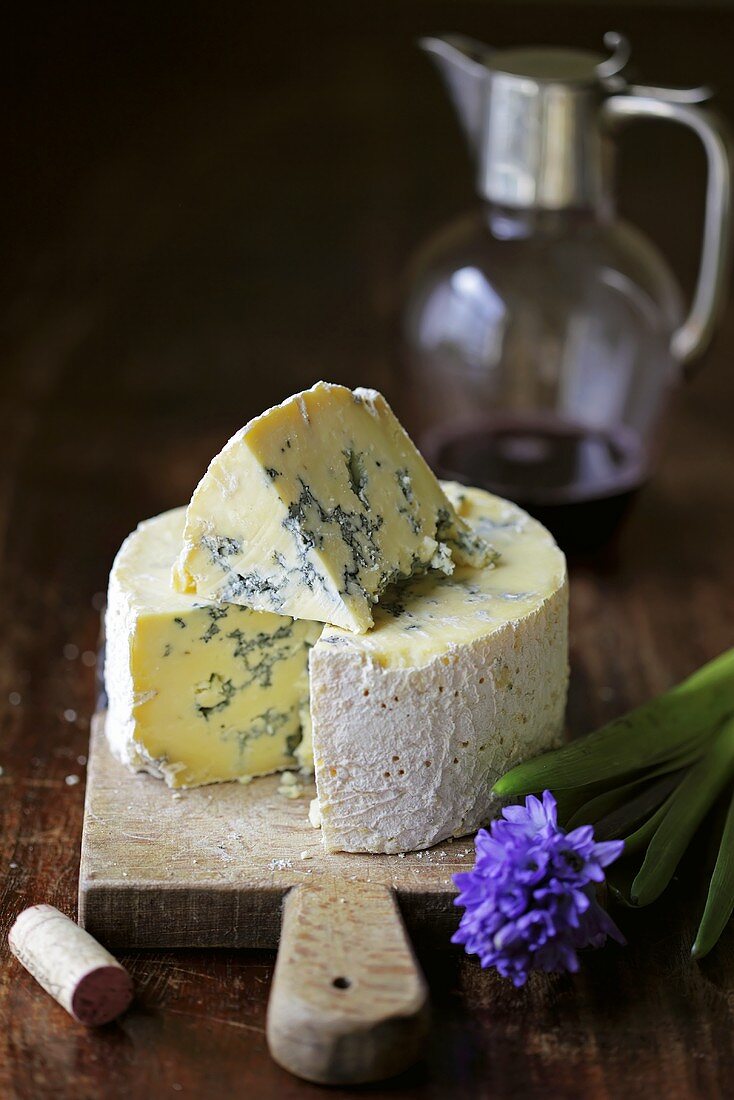 Blue Stilton cheese on a wooden board