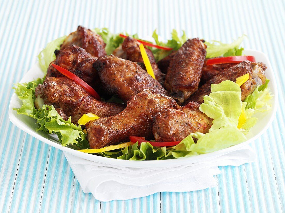 Chicken wings on salad