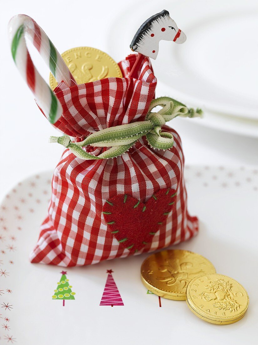 Assorted Christmas sweets in checked bag