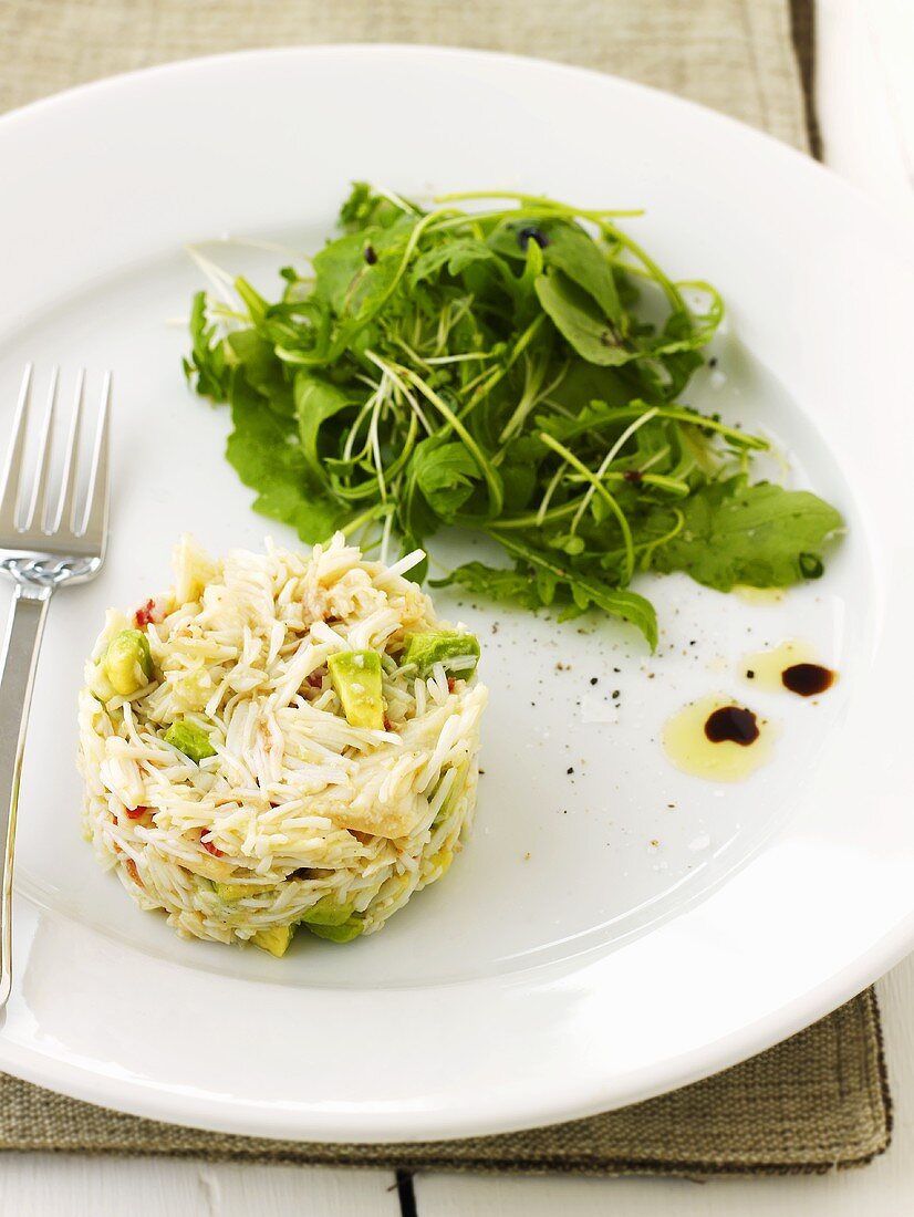 Crabmeat and avocado salad with salad leaves