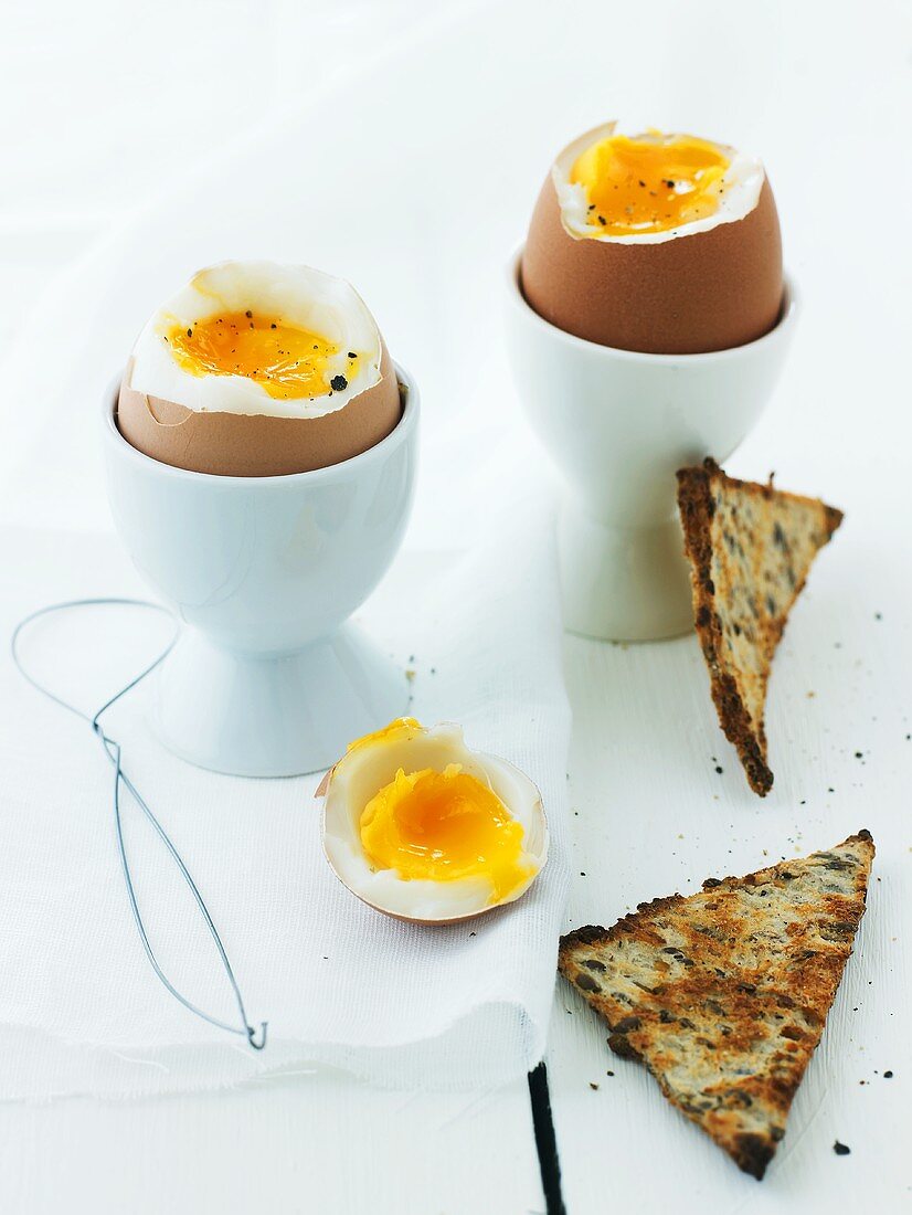 Two boiled eggs with toast triangles