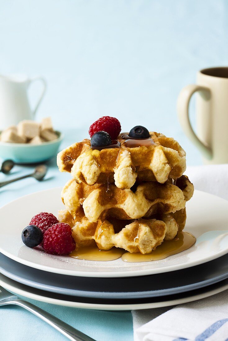 Belgian waffles with maple syrup and berries