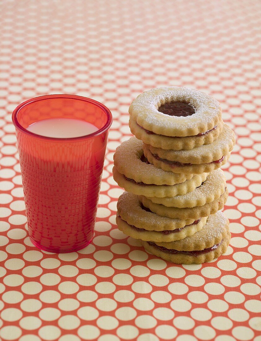 Jam biscuits and glass of milk