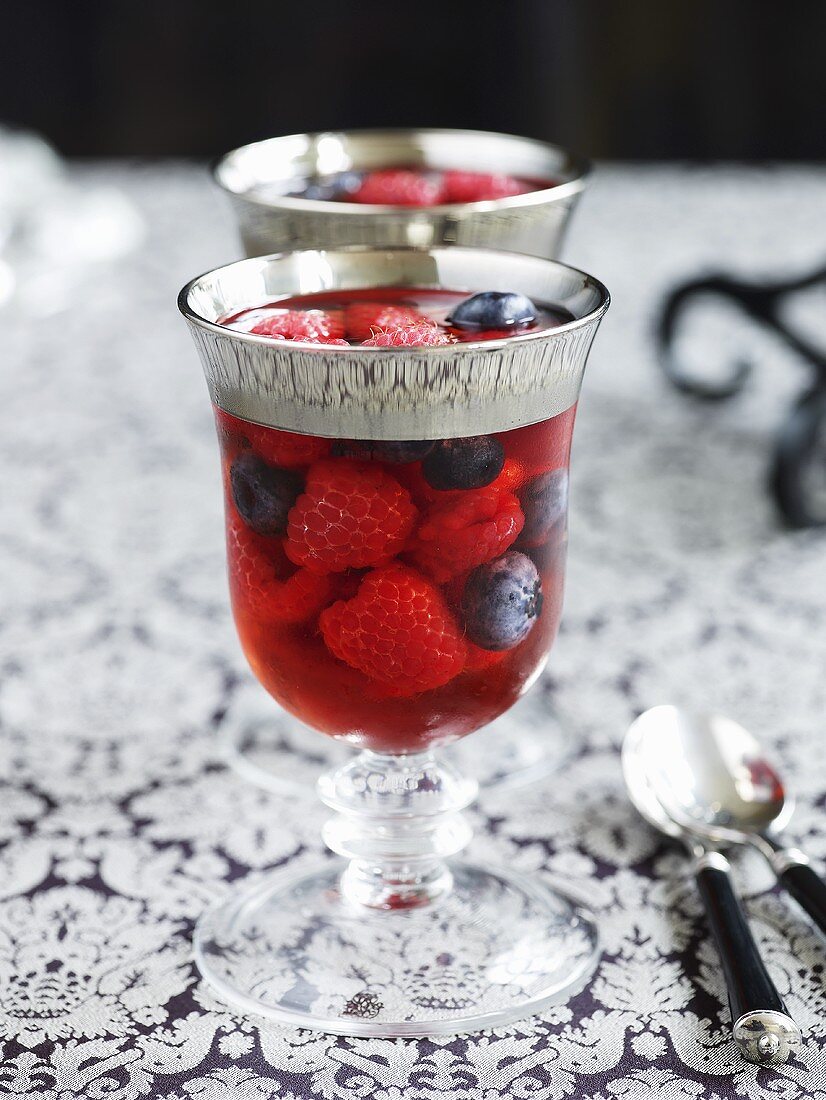 Berries in jelly in elegant glasses