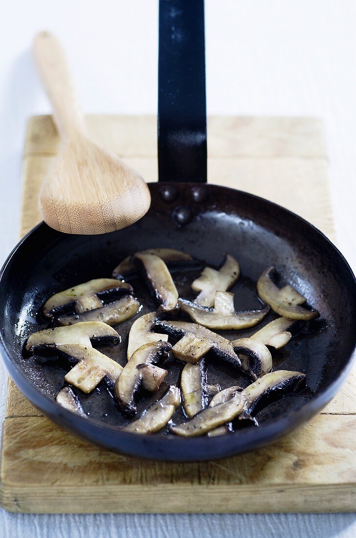 Fried mushrooms in frying pan