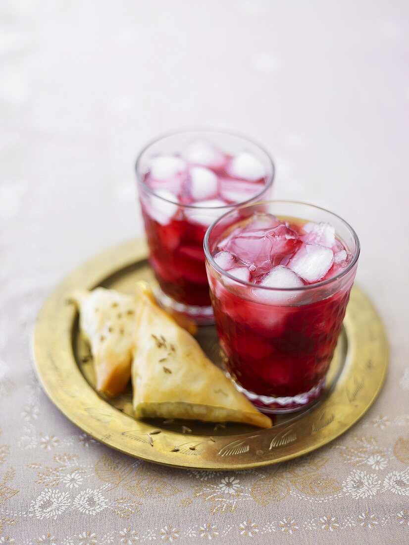 Pomegranate drinks with samosas
