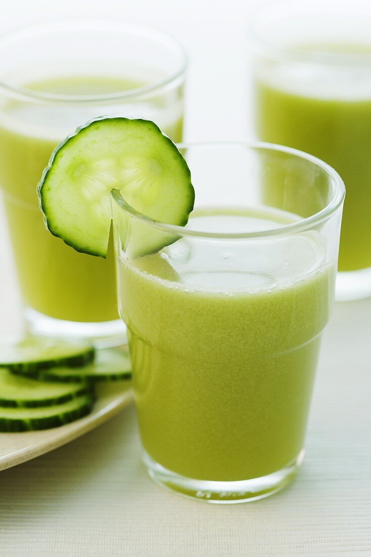 Three glasses of apple and cucumber juice