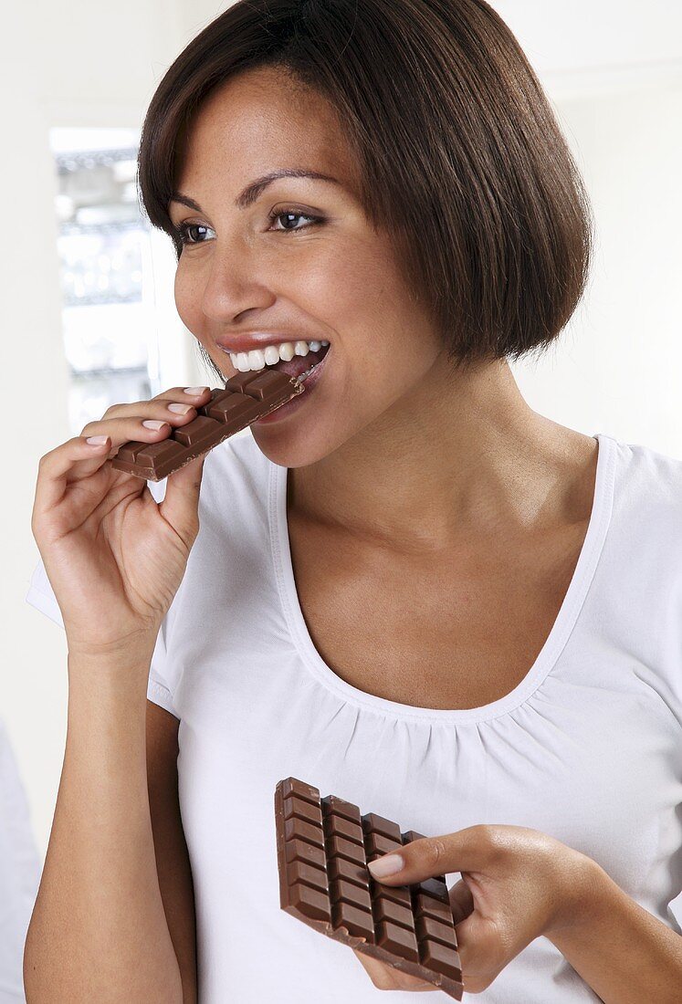 A woman eating chocolate