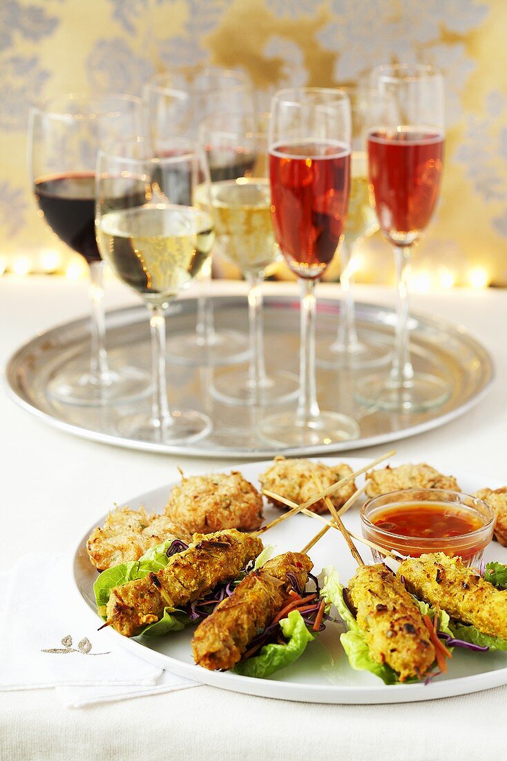 Kebabs and meatballs with a dip, wine and champagne