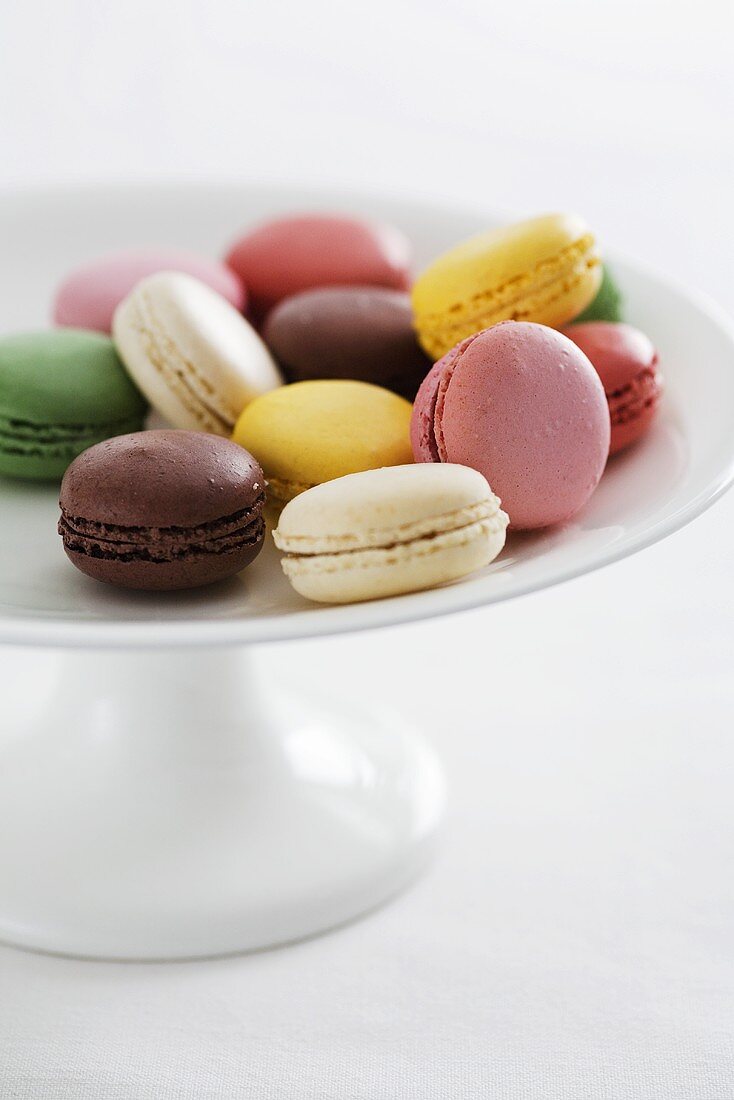 Colourful macaroons on a cake stand