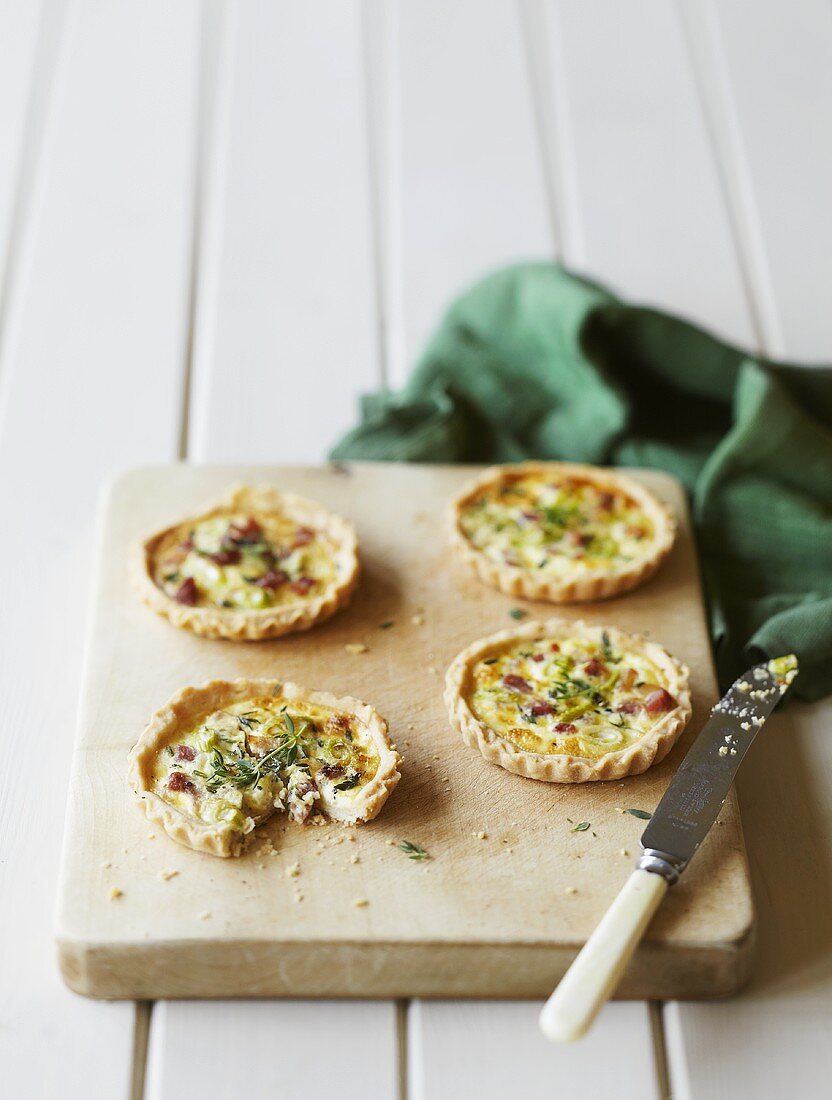 Spicy tartlets on a chopping board