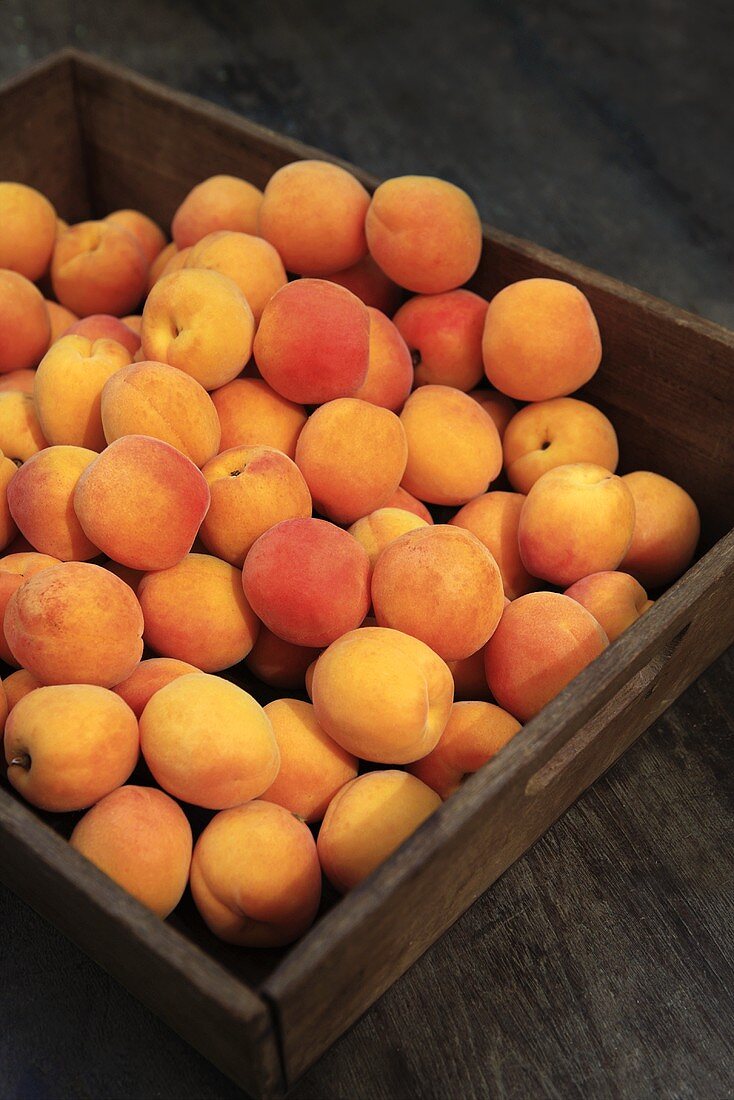 Apricots in a wooden crate
