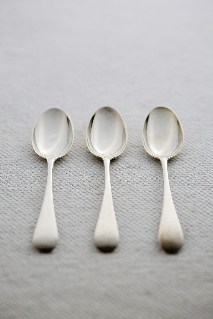 Three antique silver spoons